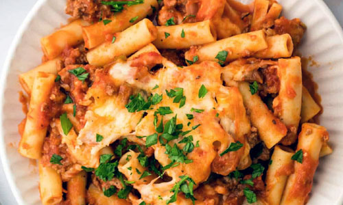 Freshly baked ziti pasta in a dish